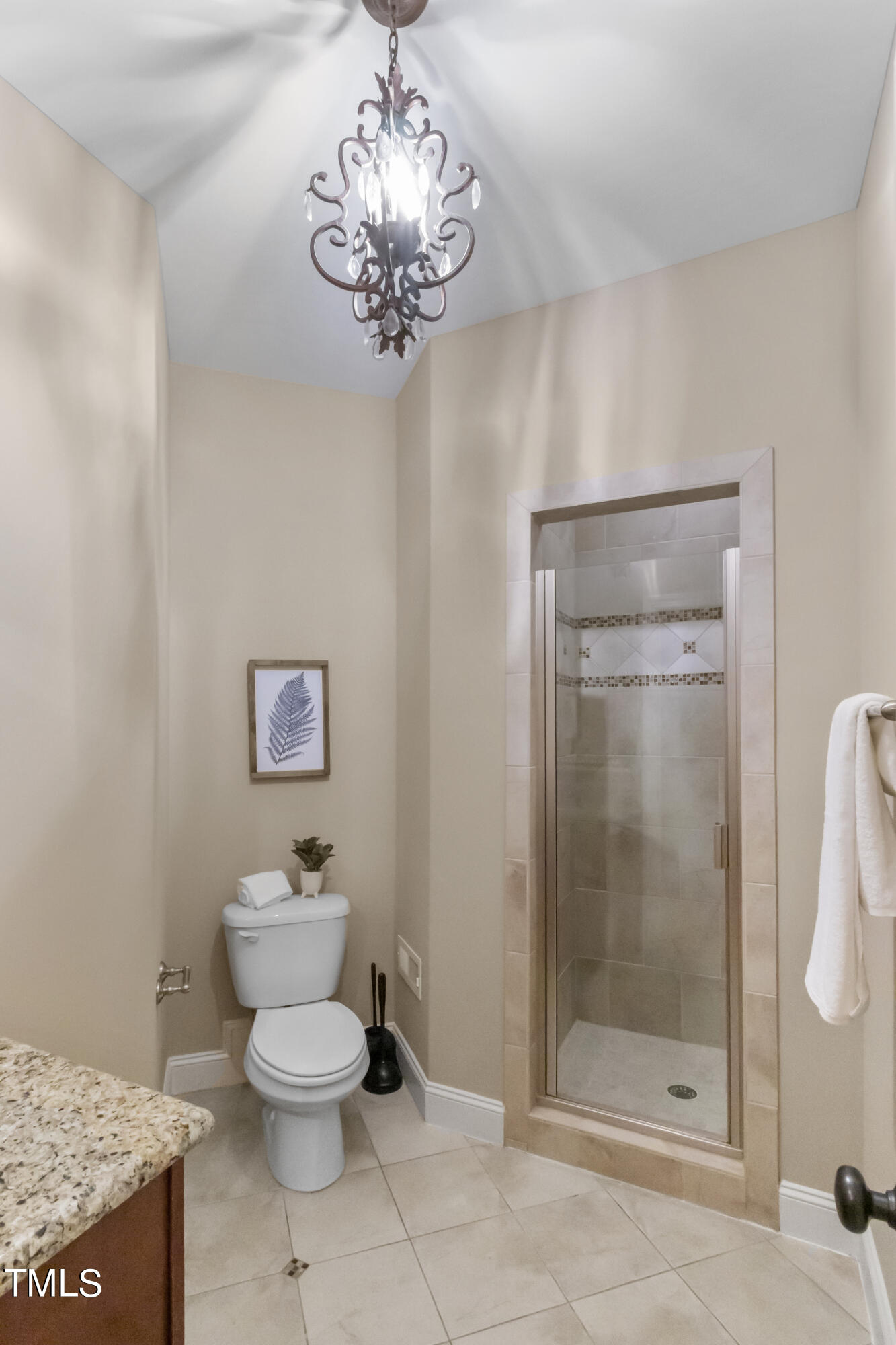 6507 Glendower Road Raleigh, NC 27613 - Photo 15 of 42 a bathroom with a toilet sink and shower