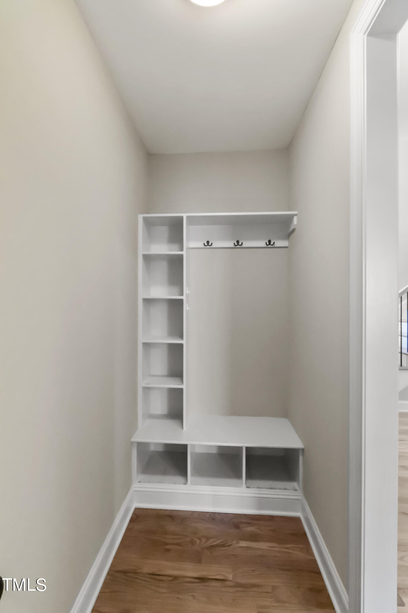 6507 Glendower Road Raleigh, NC 27613 - Photo 16 of 42 a view of walk in closet with empty racks