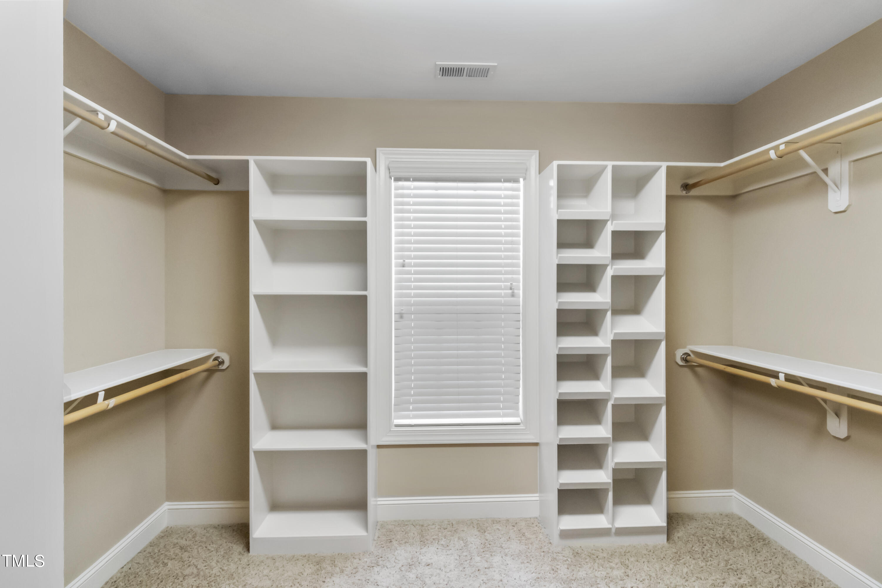 6507 Glendower Road Raleigh, NC 27613 - Photo 23 of 42 a view of an empty room with empty shelves