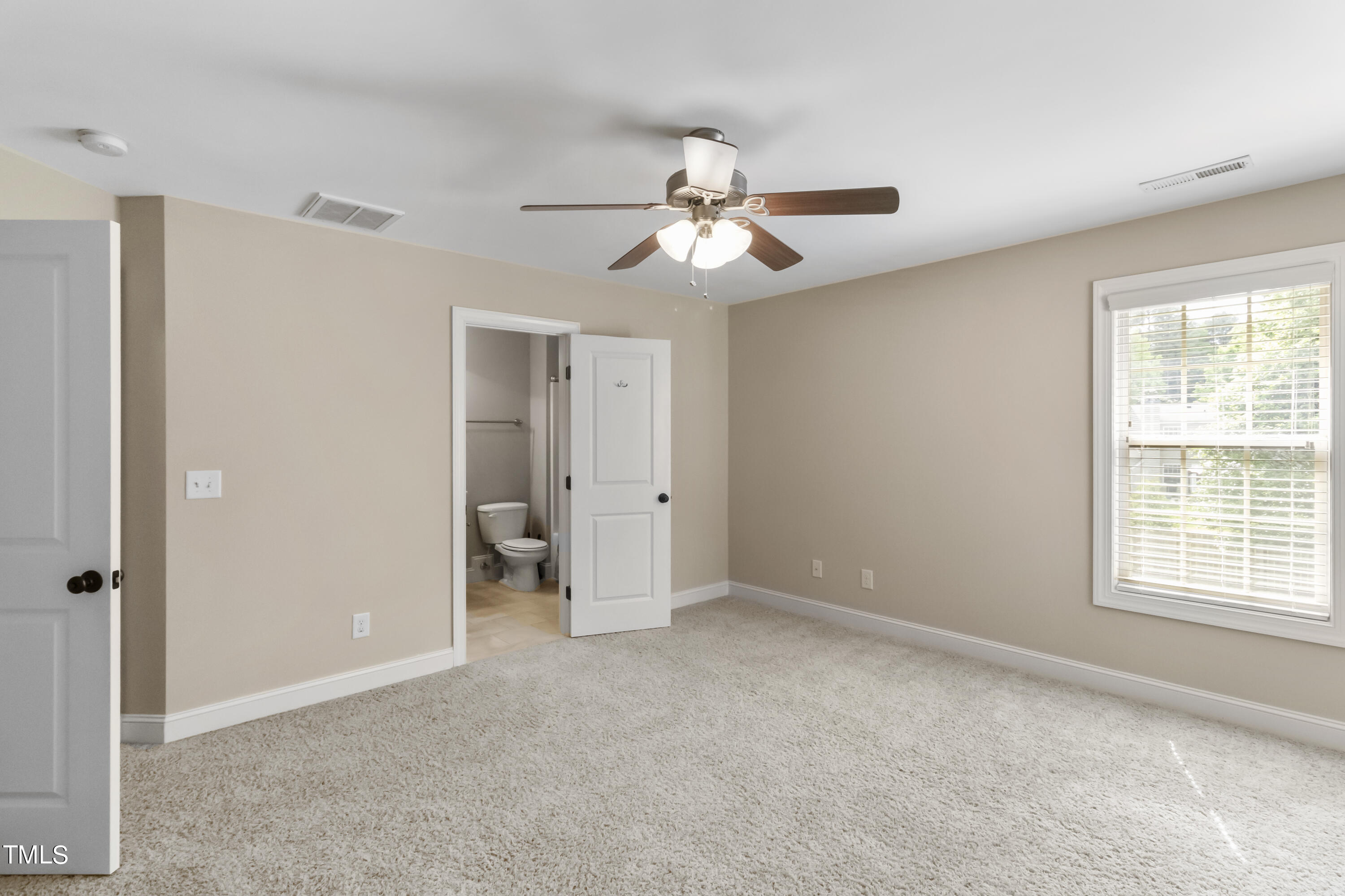6507 Glendower Road Raleigh, NC 27613 - Photo 25 of 42 a view of an empty room with a window