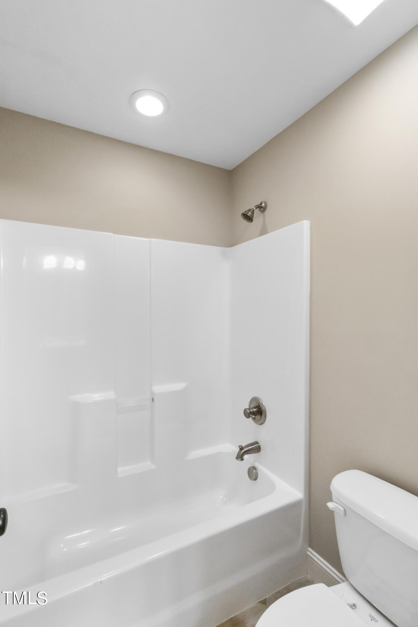 6507 Glendower Road Raleigh, NC 27613 - Photo 31 of 42 a bathroom with a bathtub and toilet