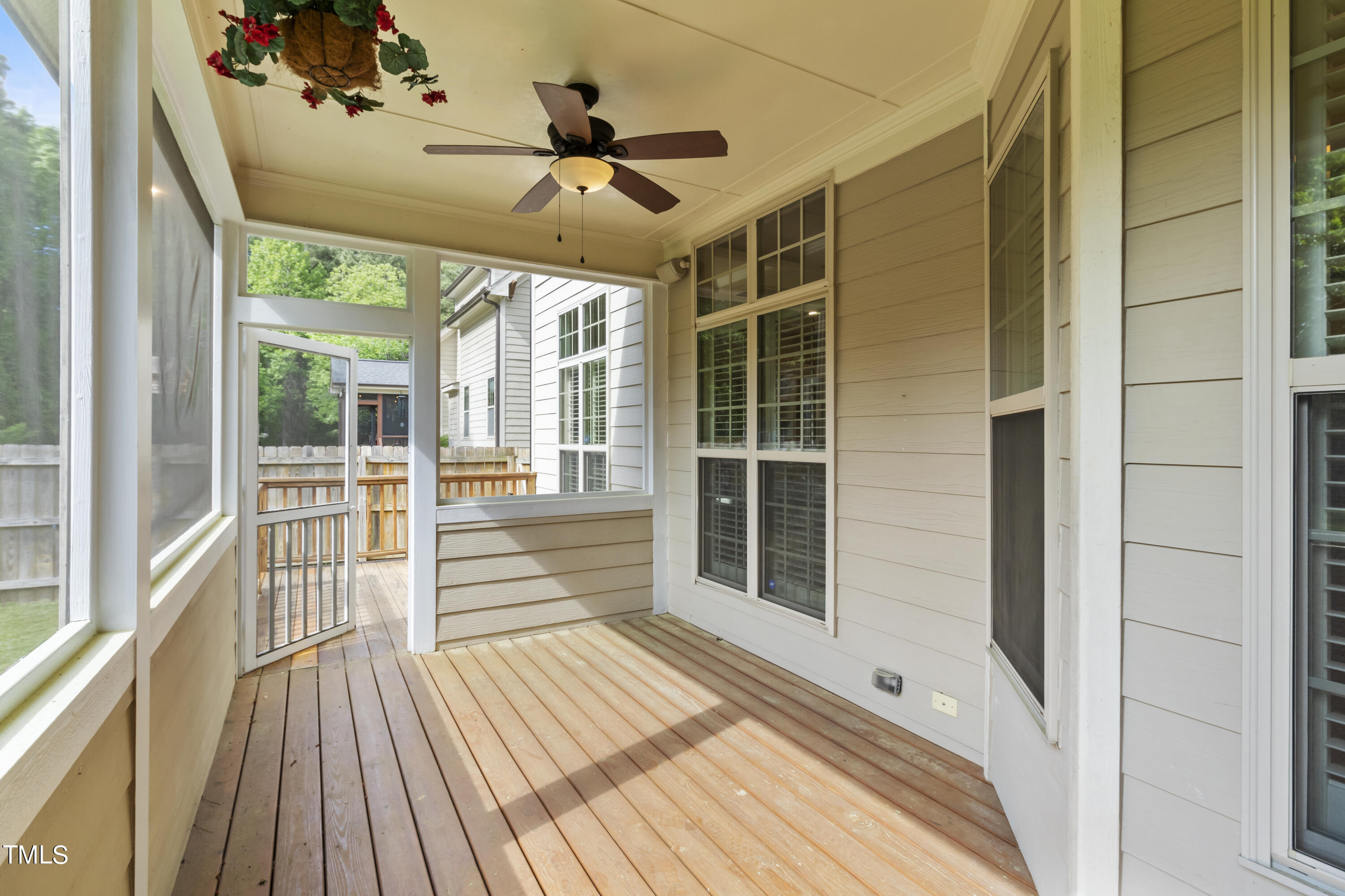 6507 Glendower Road Raleigh, NC 27613 - Photo 35 of 42 a view of a porch with wooden floor and city view