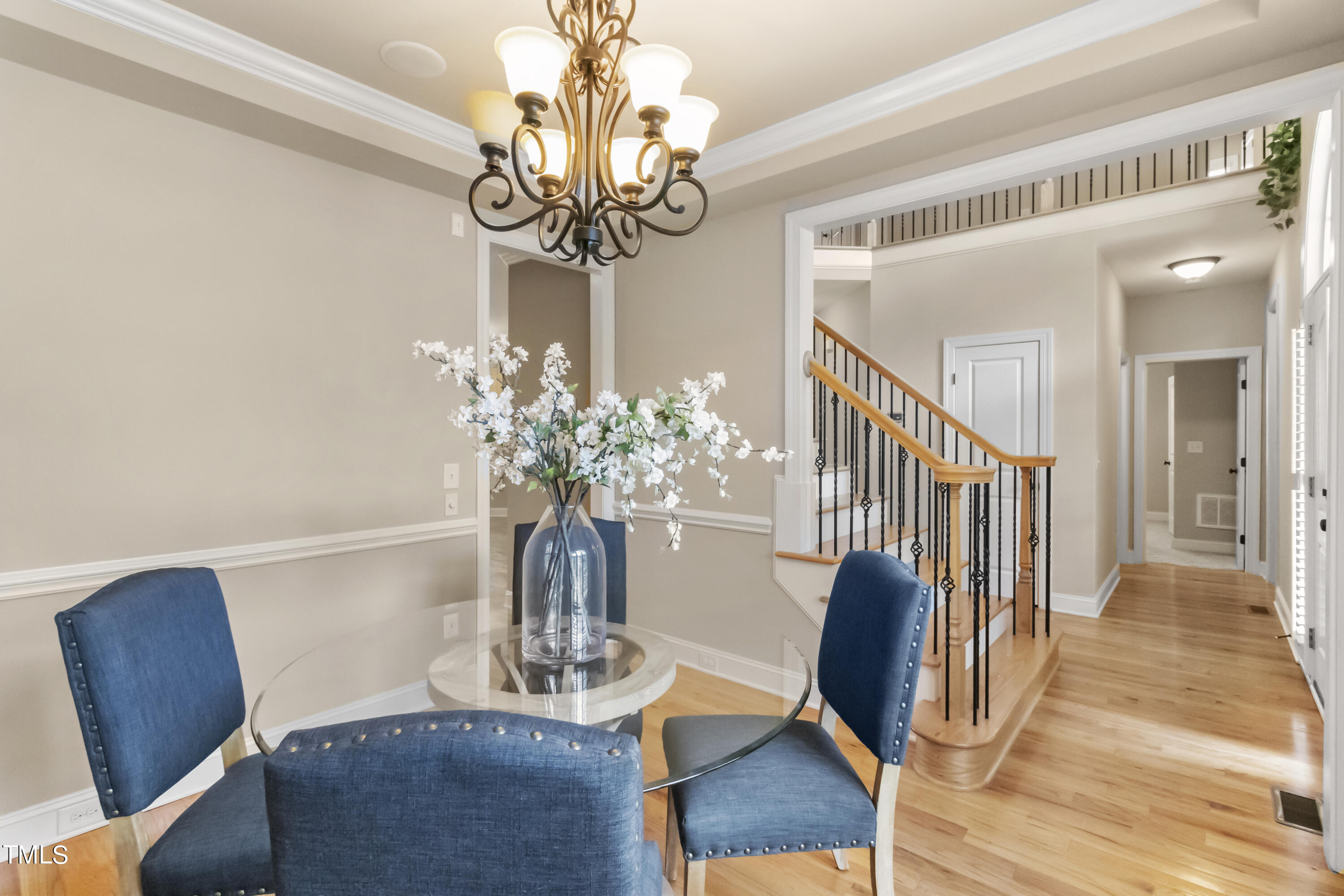 6507 Glendower Road Raleigh, NC 27613 - Photo 4 of 42 a view of a dining room with furniture and wooden floor