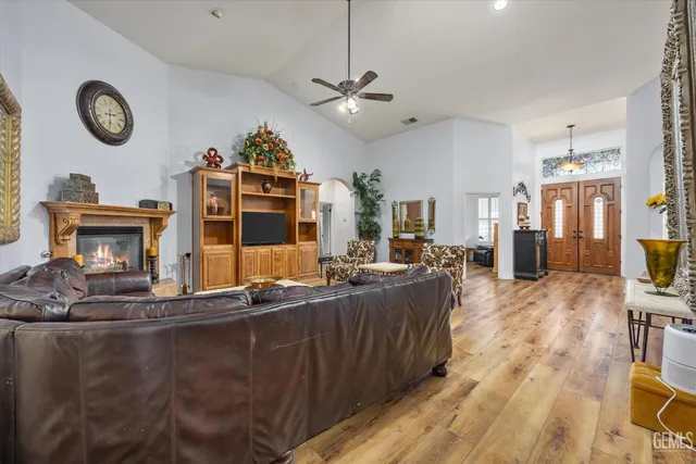 a living room with fireplace furniture and a flat screen tv