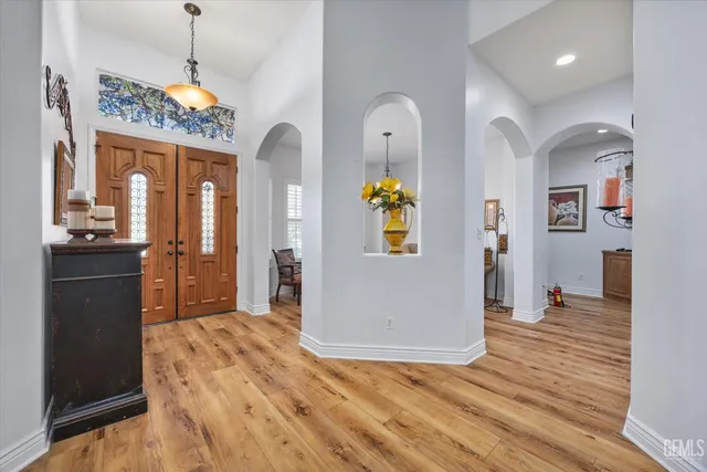 a view of livingroom with furniture staircase and front door
