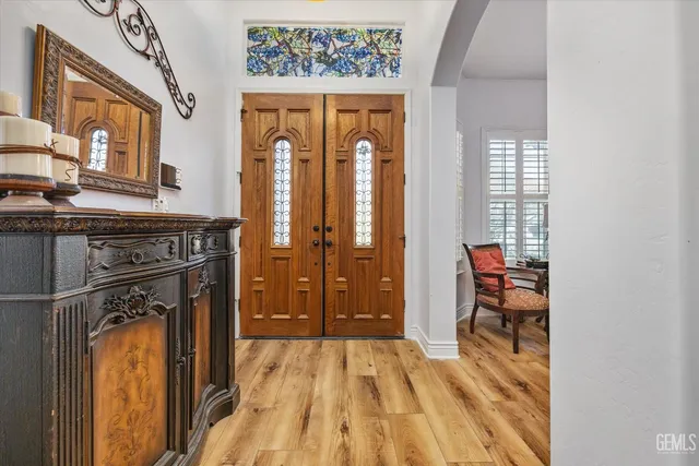 a view of front door with wooden door