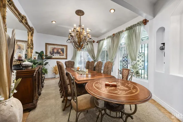 a living room with fireplace furniture and a chandelier