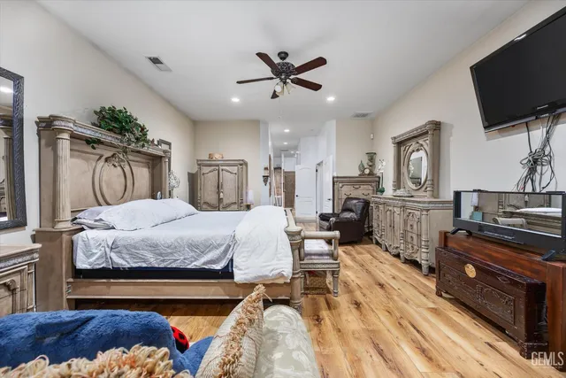 a spacious bathroom with a tub a mirror and shower