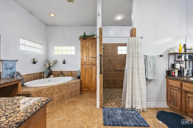 a bathroom with a tub and sink