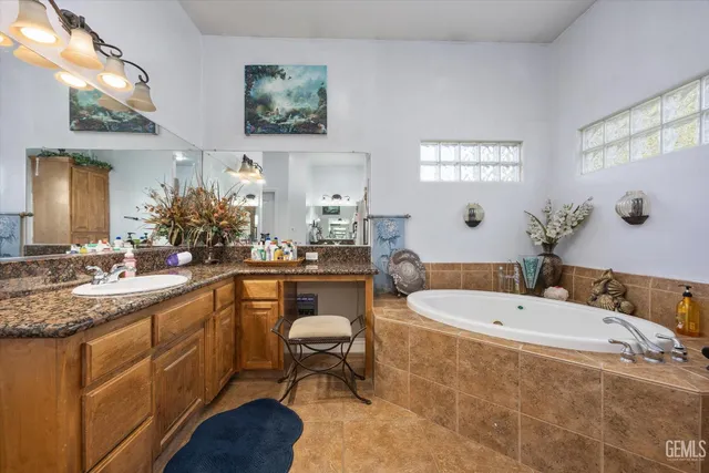 a bathroom with a sink a mirror and a shower
