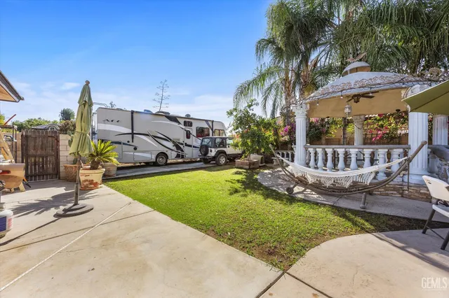a view of a swimming pool with outdoor seating