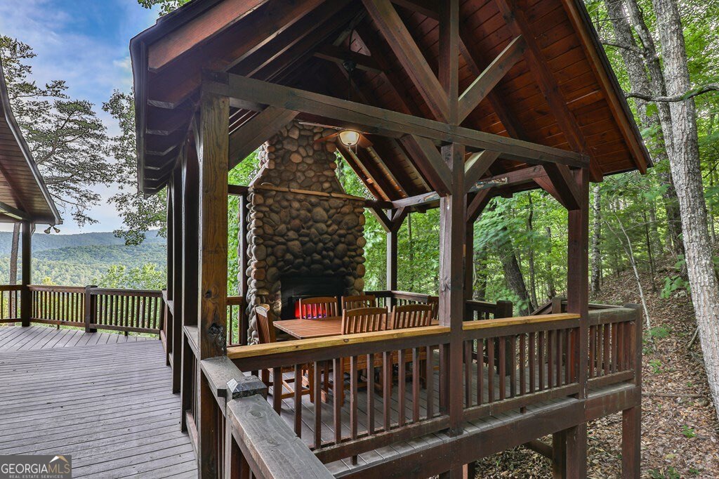 175 Cochise Road, Unit 19 Cherry Log, GA 30522 - Photo 12 of 89 a view of a roof deck with wooden floor and fence
