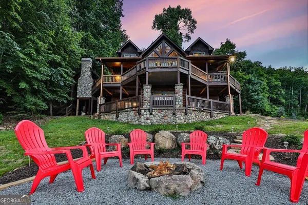 a view of a two chair and a table in the balcony