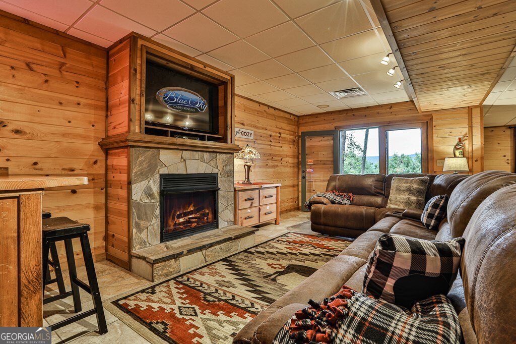 175 Cochise Road, Unit 19 Cherry Log, GA 30522 - Photo 24 of 89 a living room with furniture a rug and a fireplace