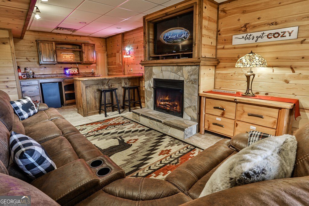 175 Cochise Road, Unit 19 Cherry Log, GA 30522 - Photo 25 of 89 a living room with furniture a flat screen tv and a fireplace