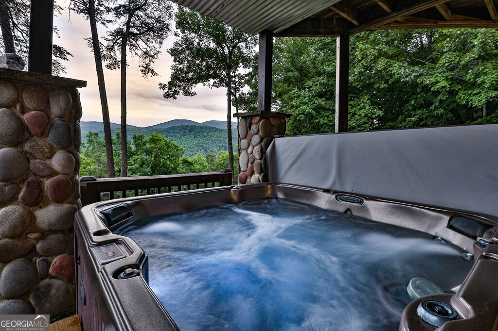 175 Cochise Road, Unit 19 Cherry Log, GA 30522 - Photo 32 of 89 a view of a two chair and a table in the balcony