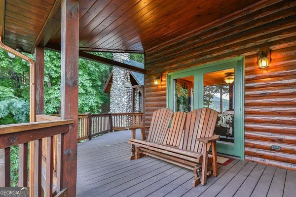 a view of living room with balcony and furniture