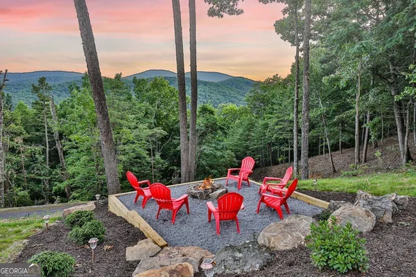 a kitchen with stainless steel appliances granite countertop a stove a sink dishwasher and a refrigerator