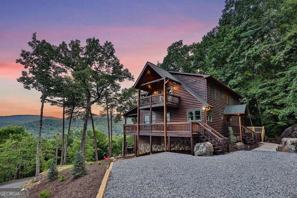 175 Cochise Road, Unit 19 Cherry Log, GA 30522 - Photo 48 of 89 a view of a house with a yard and balcony