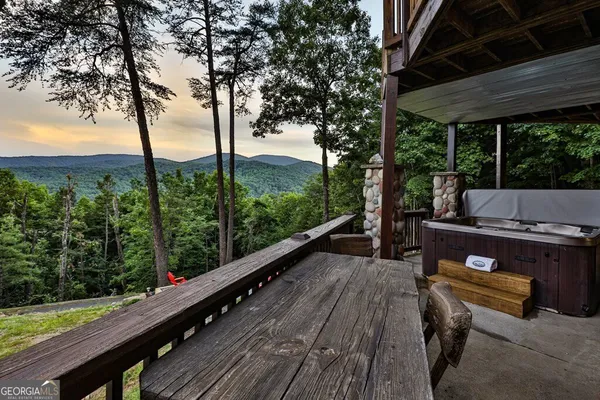 a view of a yard with large tree and a table