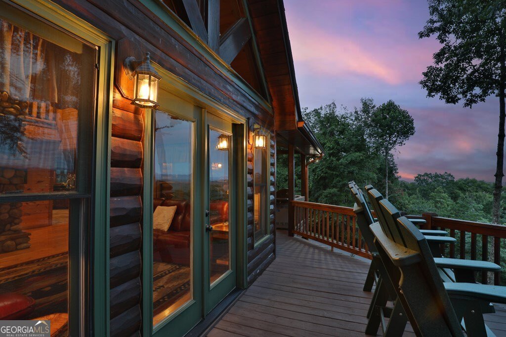175 Cochise Road, Unit 19 Cherry Log, GA 30522 - Photo 54 of 89 a balcony with wooden floor and outdoor seating