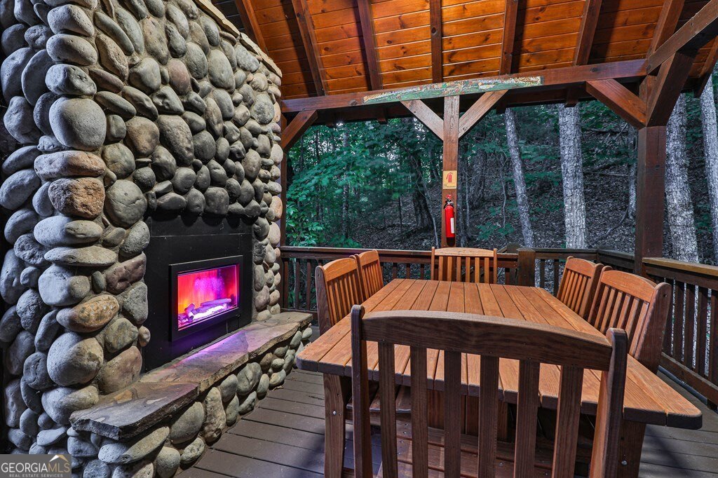 175 Cochise Road, Unit 19 Cherry Log, GA 30522 - Photo 56 of 89 a view of a chairs and a table in the balcony