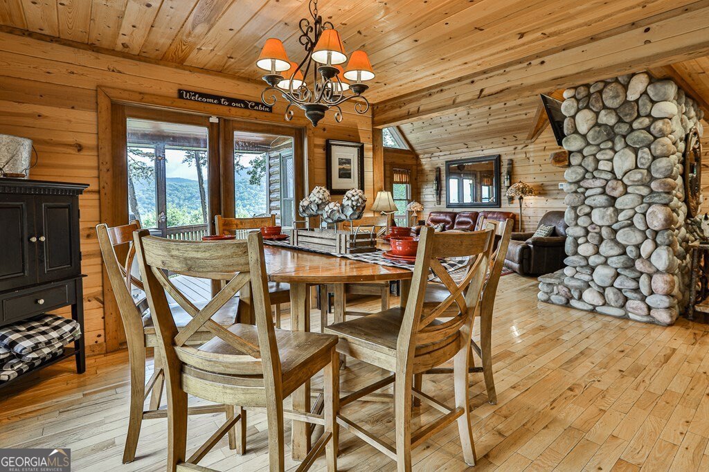 175 Cochise Road, Unit 19 Cherry Log, GA 30522 - Photo 63 of 89 a view of a dining room with furniture wooden floor and chandelier