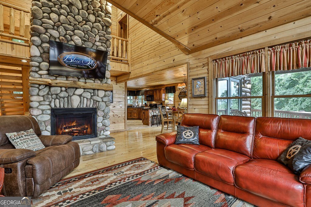175 Cochise Road, Unit 19 Cherry Log, GA 30522 - Photo 65 of 89 a living room with furniture a fireplace and a table