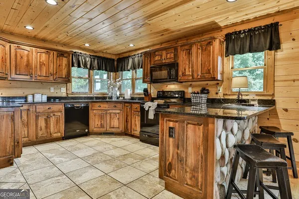 a view of a roof deck with wooden floor and fence