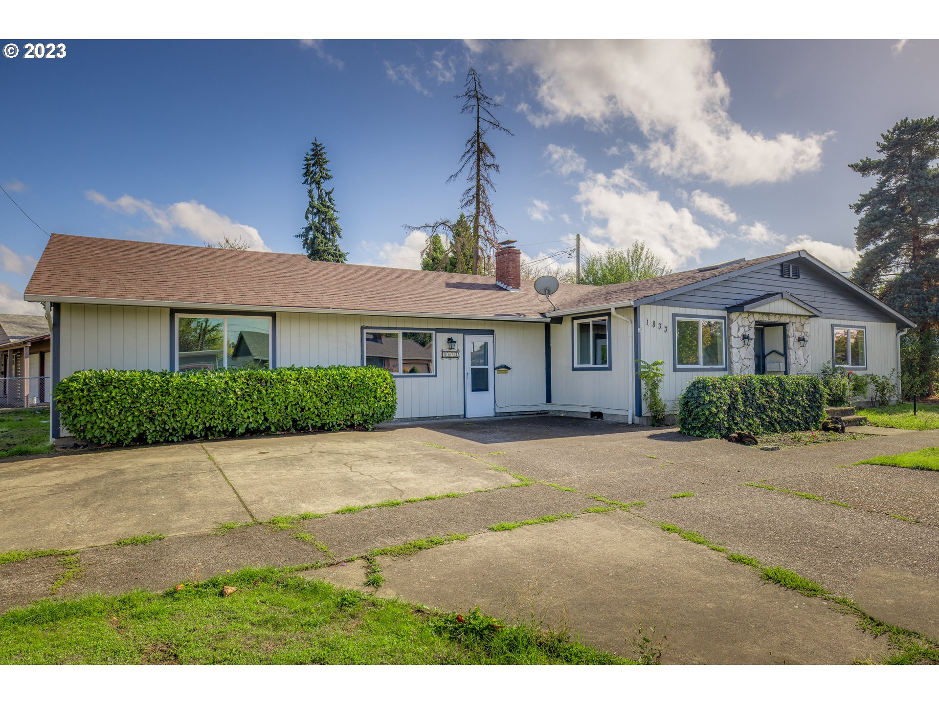 1833 North 12th Street Springfield, OR 97477 - Photo 1 of 37 a view of a house with a yard