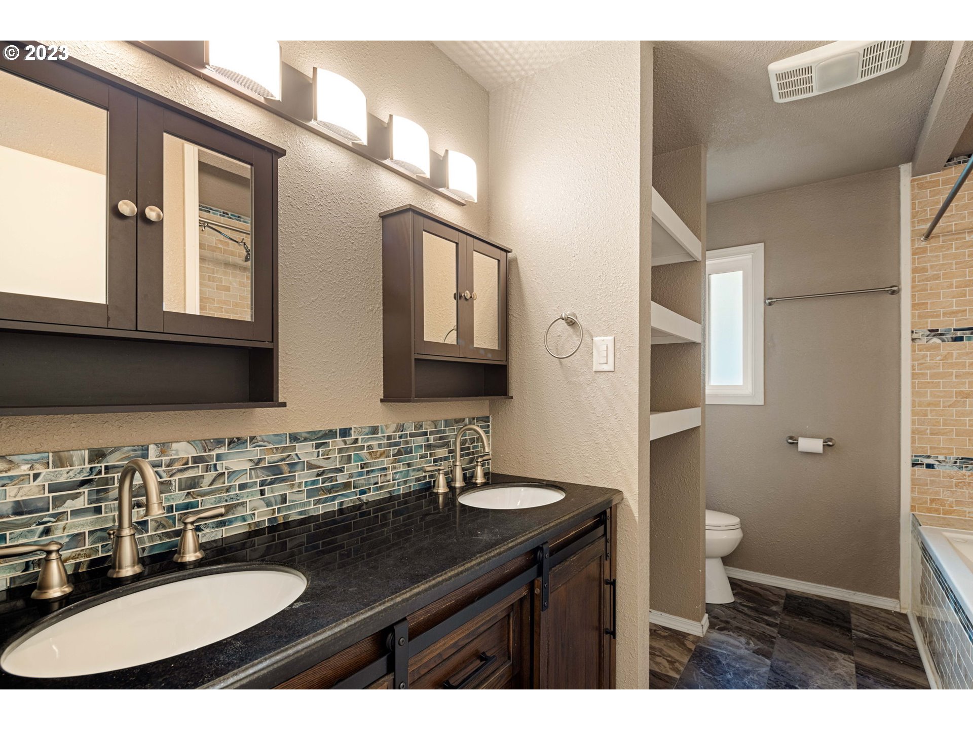 1833 North 12th Street Springfield, OR 97477 - Photo 13 of 37 a bathroom with a sink and a mirror