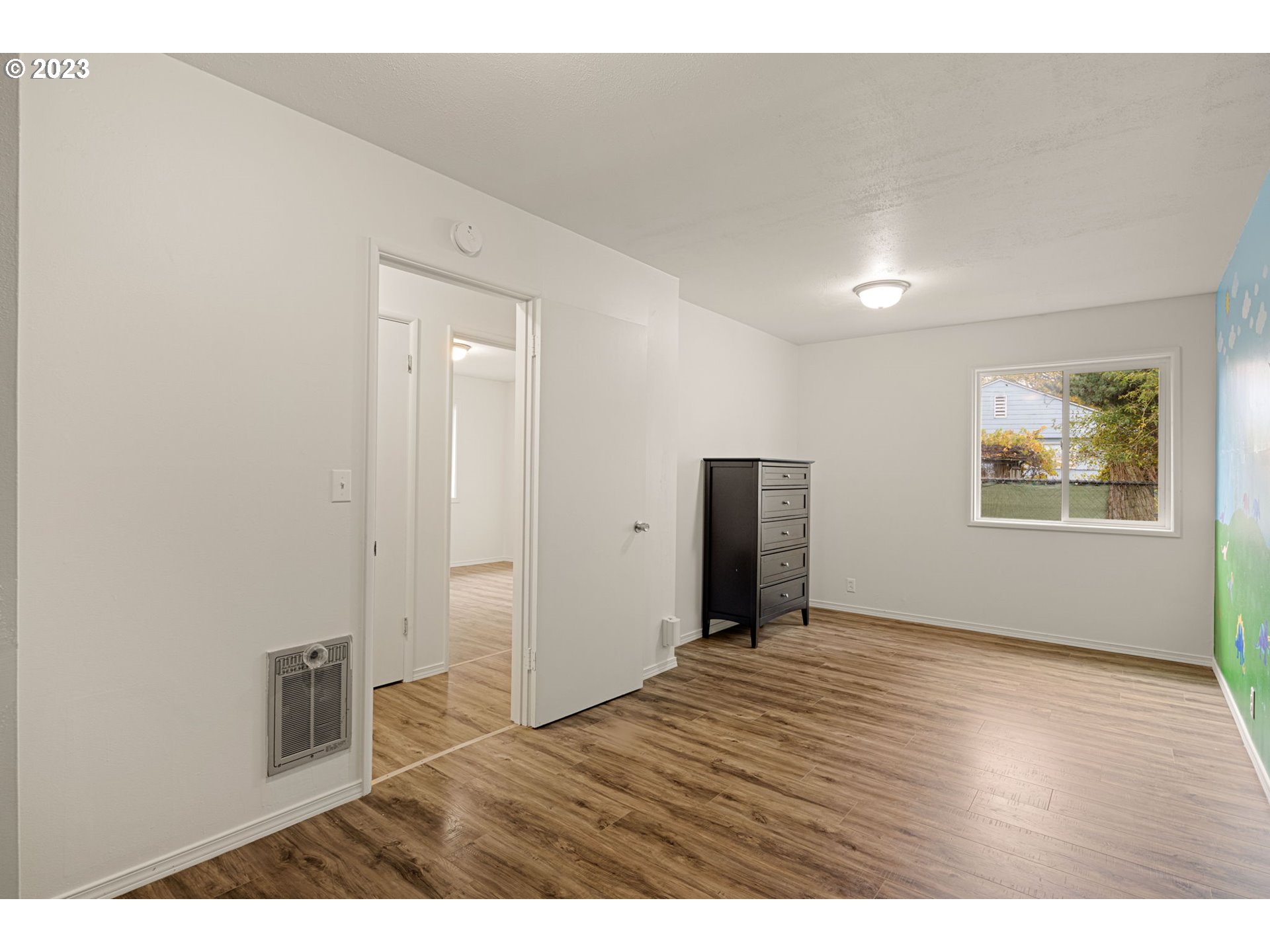 1833 North 12th Street Springfield, OR 97477 - Photo 16 of 37 a view of an empty room with wooden floor