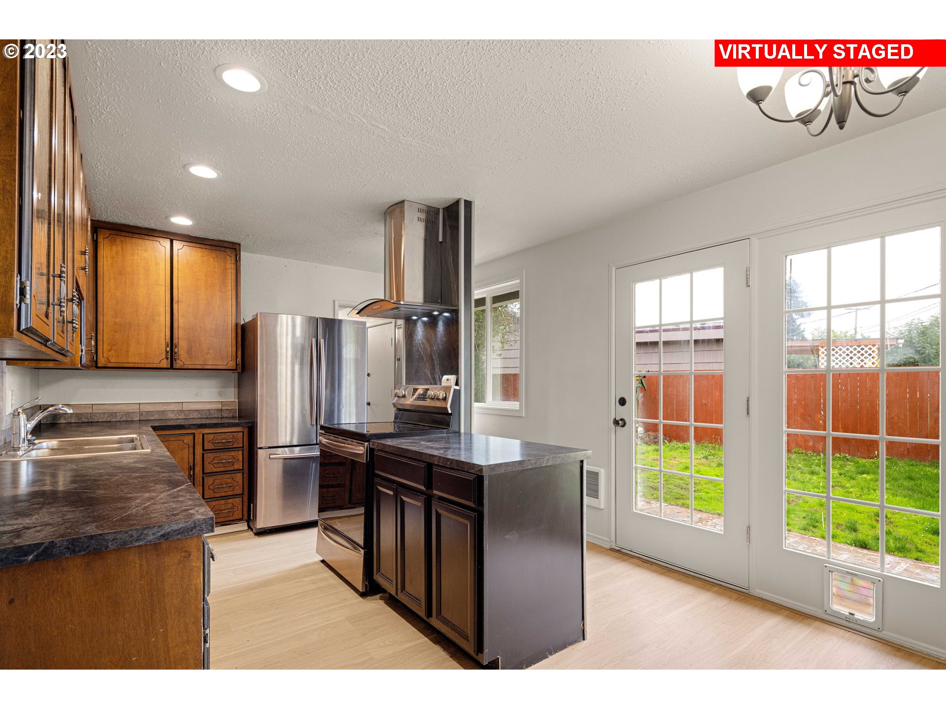 1833 North 12th Street Springfield, OR 97477 - Photo 20 of 37 a kitchen with stainless steel appliances granite countertop a refrigerator and a sink