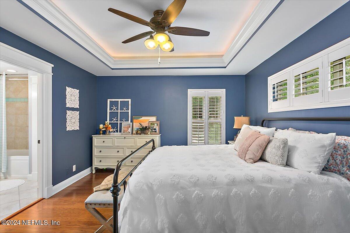 21E Casanova Road St. Augustine, FL 32080 - Photo 12 of 29 a bedroom with a bed and a table