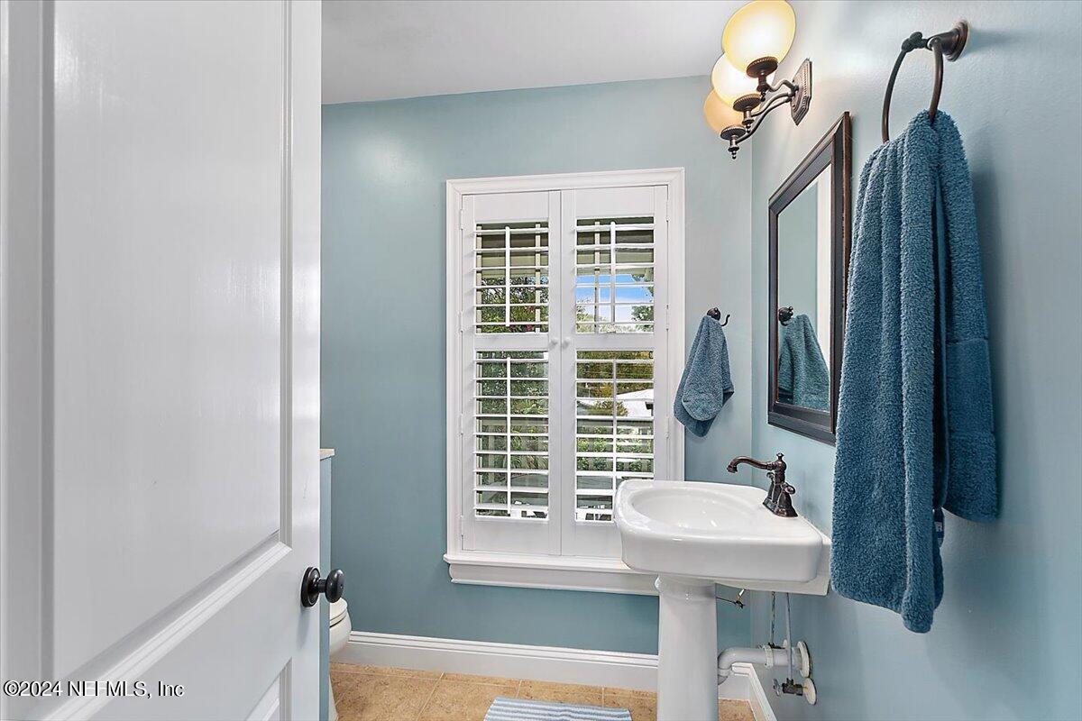 21E Casanova Road St. Augustine, FL 32080 - Photo 15 of 29 a bathroom with a sink a toilet and shower