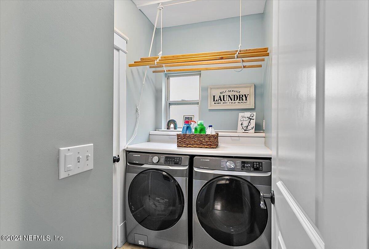 21E Casanova Road St. Augustine, FL 32080 - Photo 19 of 29 a view of bathroom with washer and dryer