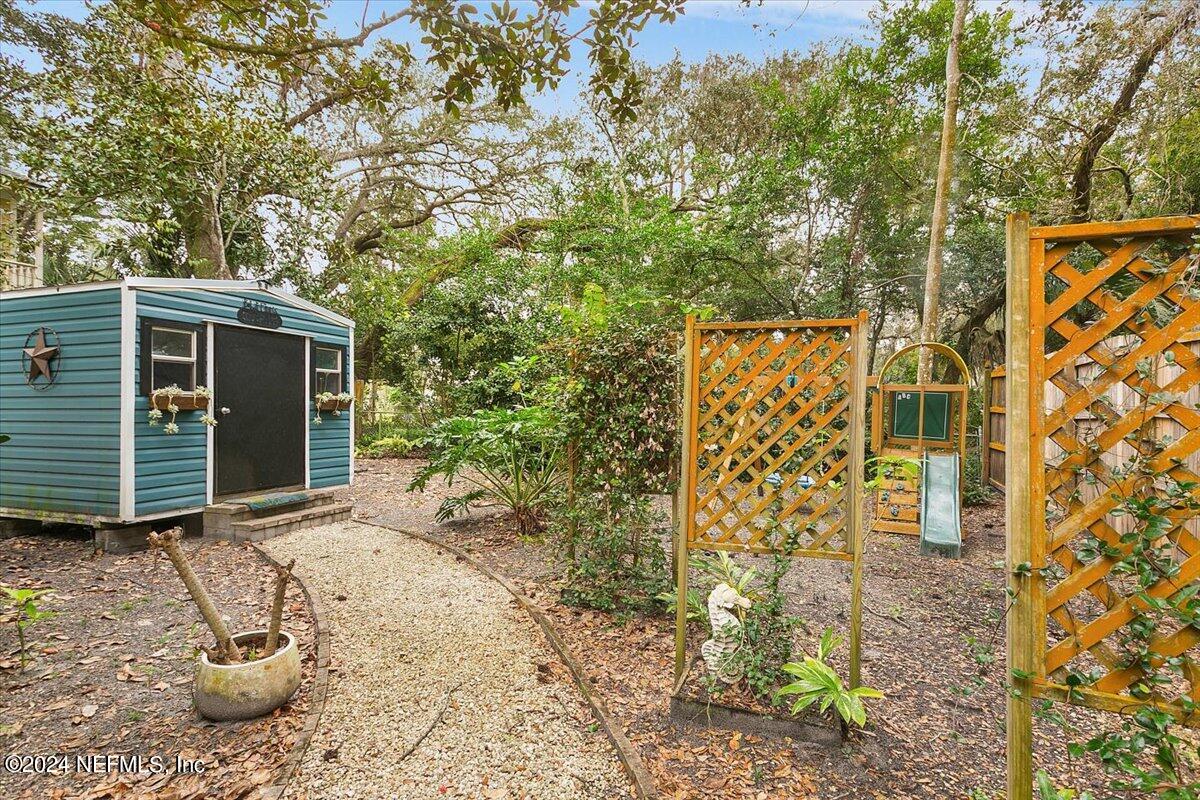 21E Casanova Road St. Augustine, FL 32080 - Photo 22 of 29 a view of house with backyard porch and entertaining space