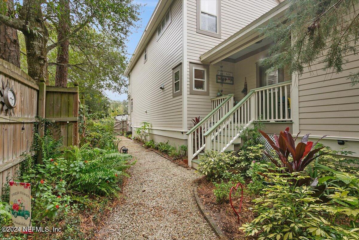 21E Casanova Road St. Augustine, FL 32080 - Photo 24 of 29 a view of a house with a small yard and wooden floor and fence