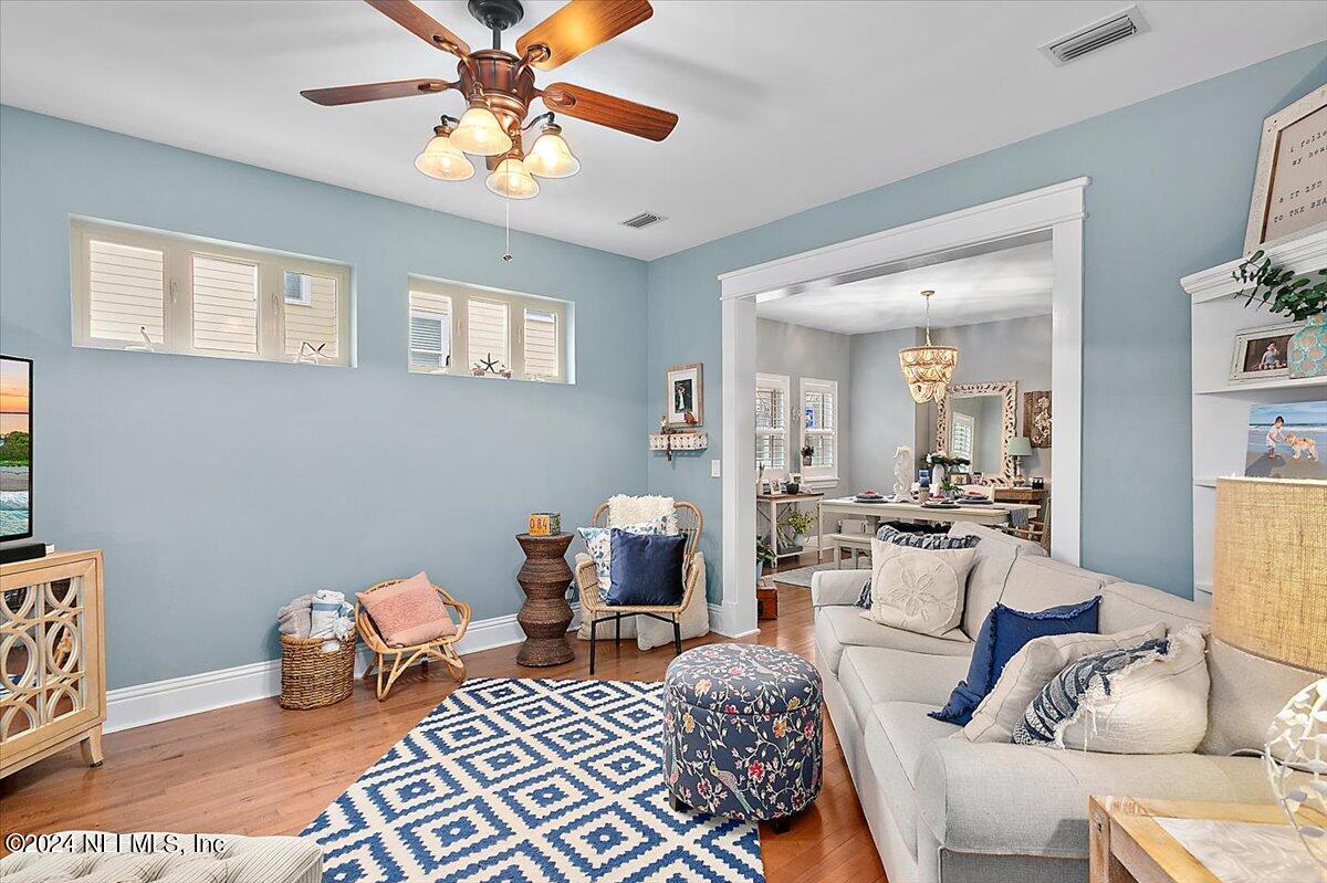 21E Casanova Road St. Augustine, FL 32080 - Photo 3 of 29 a living room with furniture and a chandelier