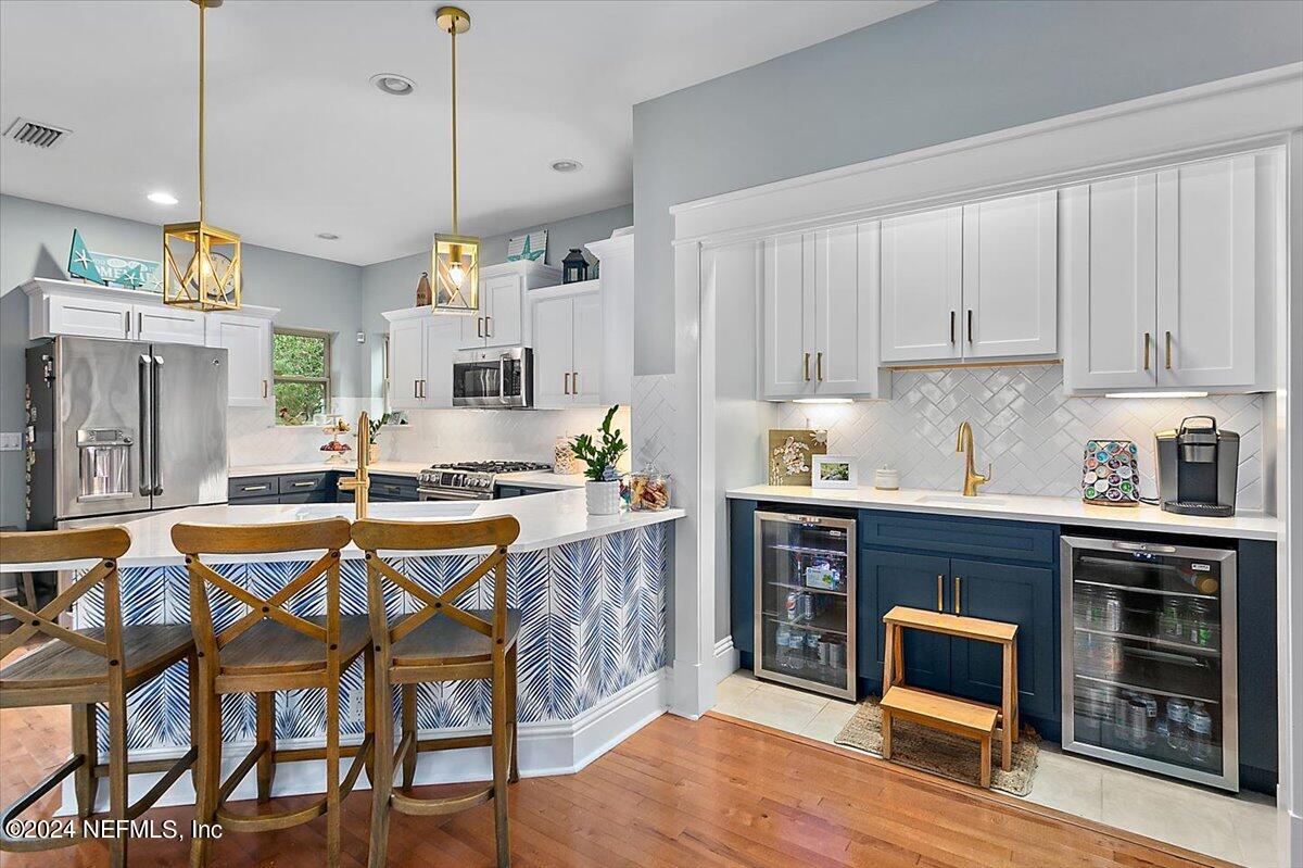 21E Casanova Road St. Augustine, FL 32080 - Photo 6 of 29 a kitchen with cabinets and chairs