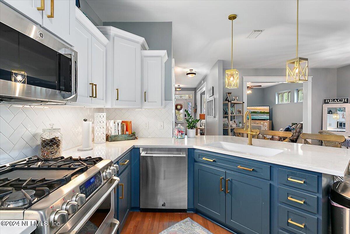 21E Casanova Road St. Augustine, FL 32080 - Photo 8 of 29 a kitchen with a sink stove and microwave