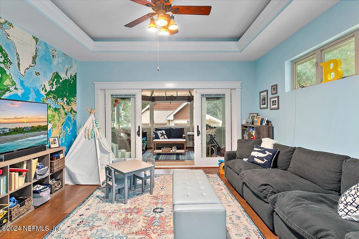 21E Casanova Road St. Augustine, FL 32080 - Photo 9 of 29 a living room with furniture and a flat screen tv
