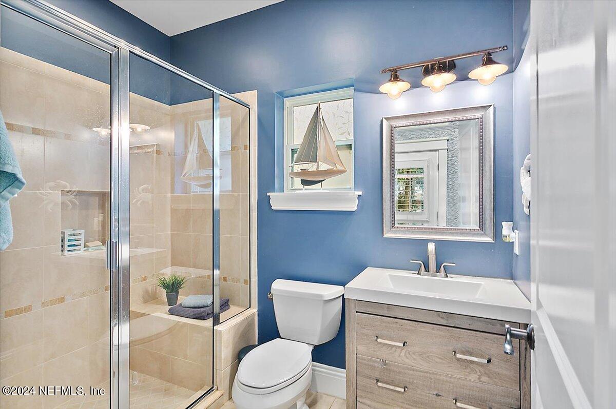 21E Casanova Road St. Augustine, FL 32080 - Photo 10 of 29 a bathroom with a sink a toilet and shower