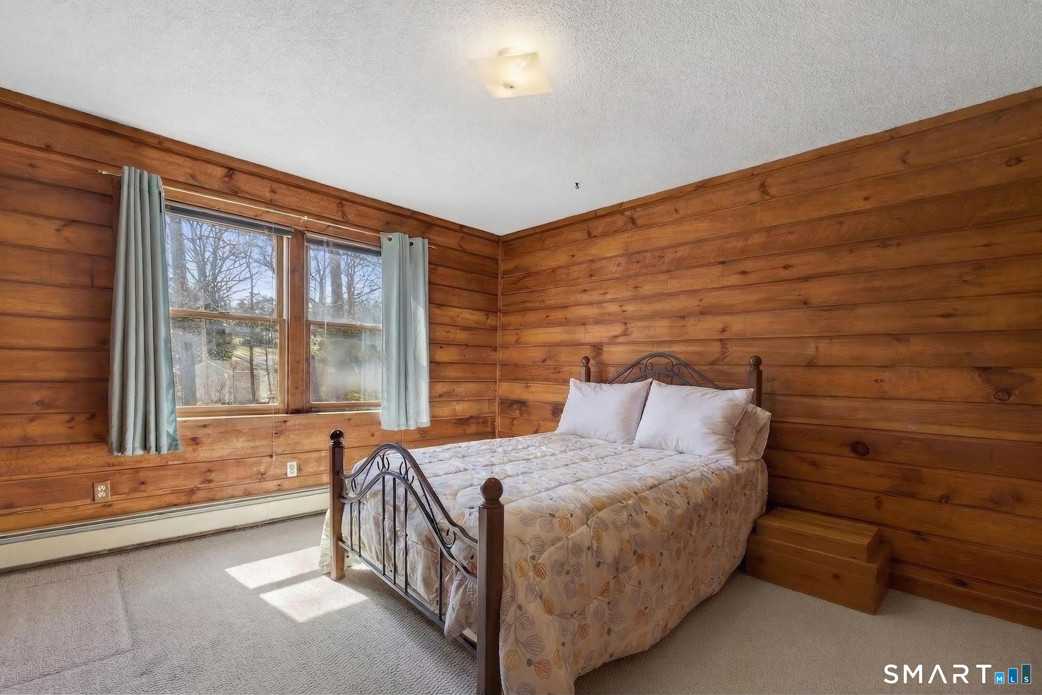 737 Shepard Avenue Hamden, CT 06514 - Photo 19 of 33 a bed sitting in a room next to a window