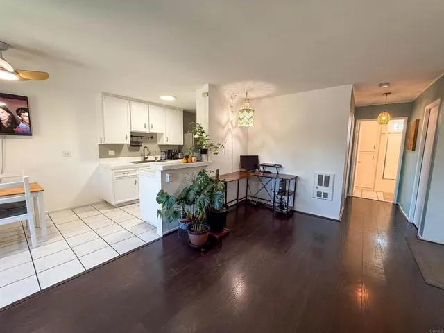 a view of a kitchen with dining table and chairs