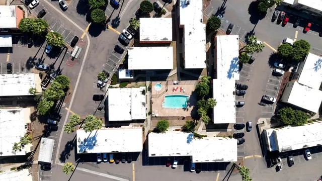 an aerial view of houses with outdoor space