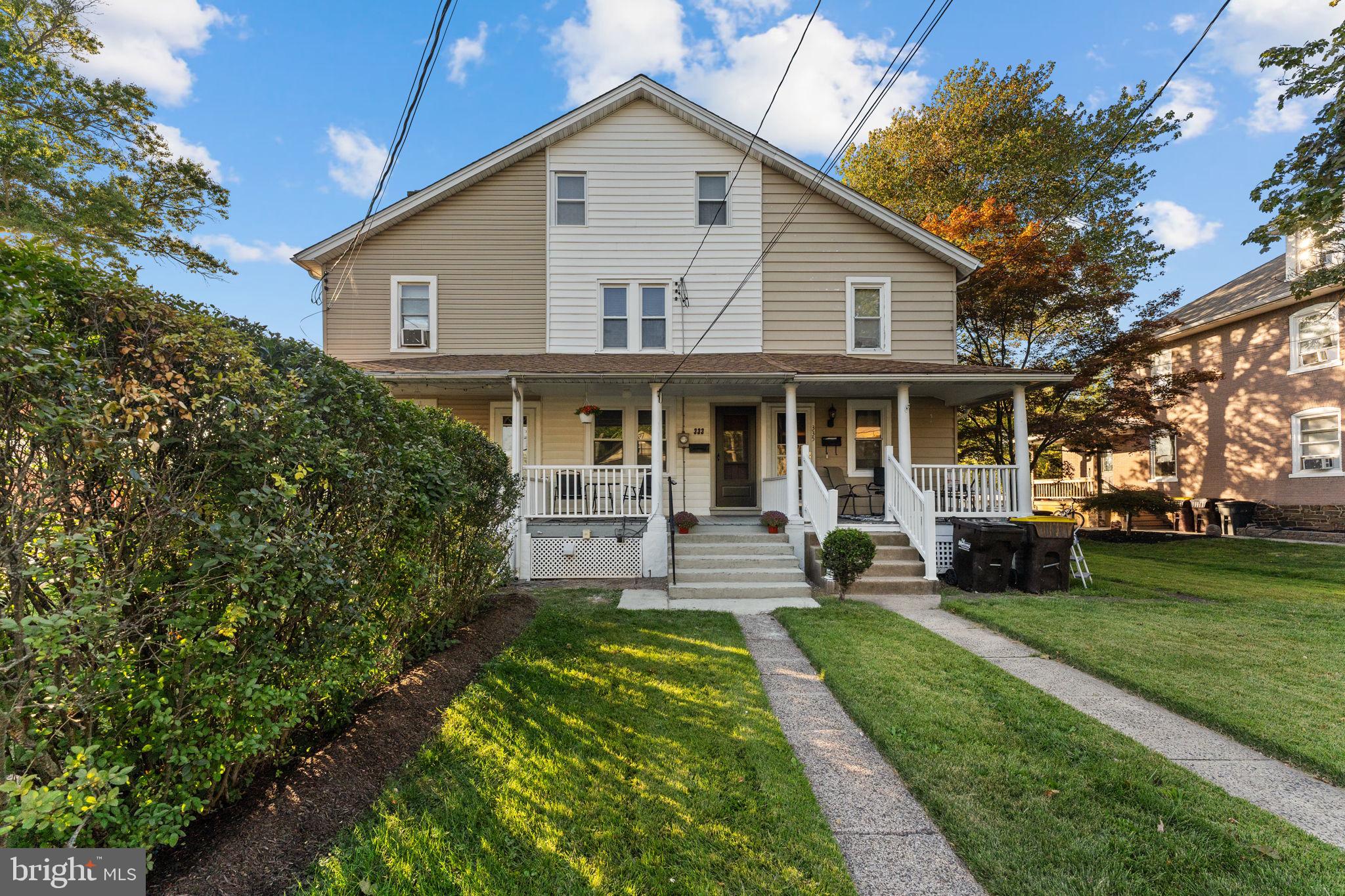 a view of a house with a yard porch and sitting area