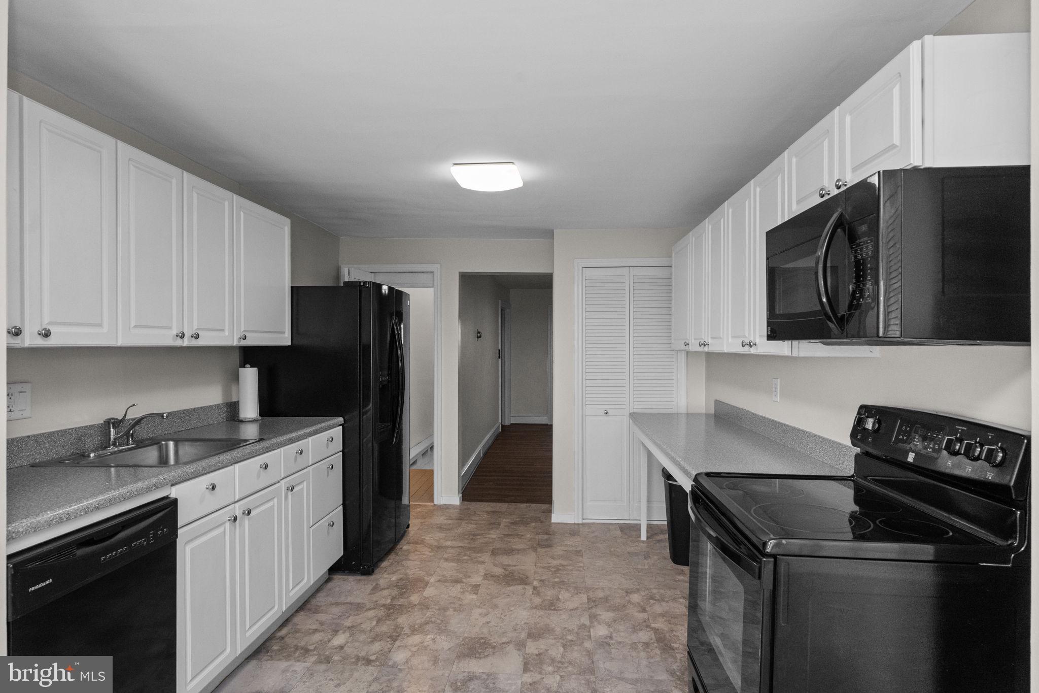 333 Union Street Hatfield, PA 19440 - Photo 11 of 35 a kitchen with a sink stove and refrigerator