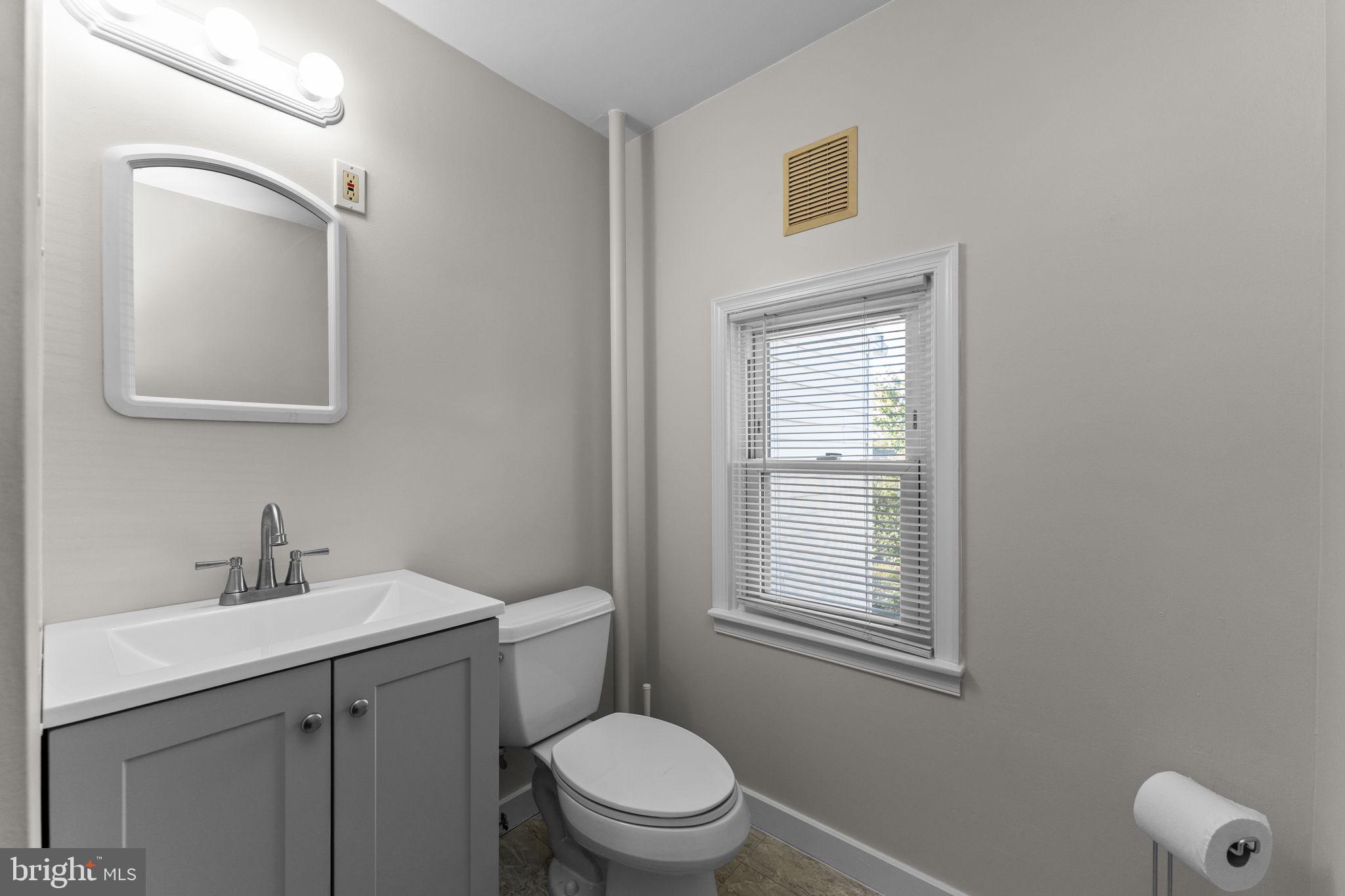 333 Union Street Hatfield, PA 19440 - Photo 28 of 35 a bathroom with a toilet sink vanity and mirror