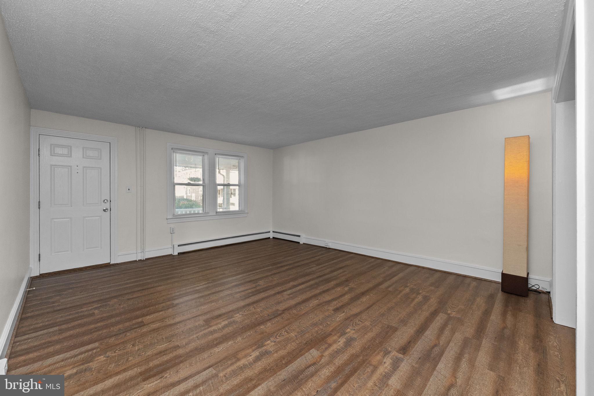 333 Union Street Hatfield, PA 19440 - Photo 4 of 35 a view of an empty room with wooden floor and window